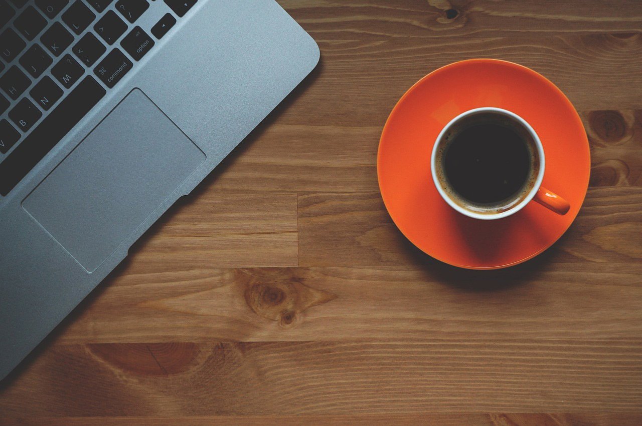 laptop for making appointments seen with coffee