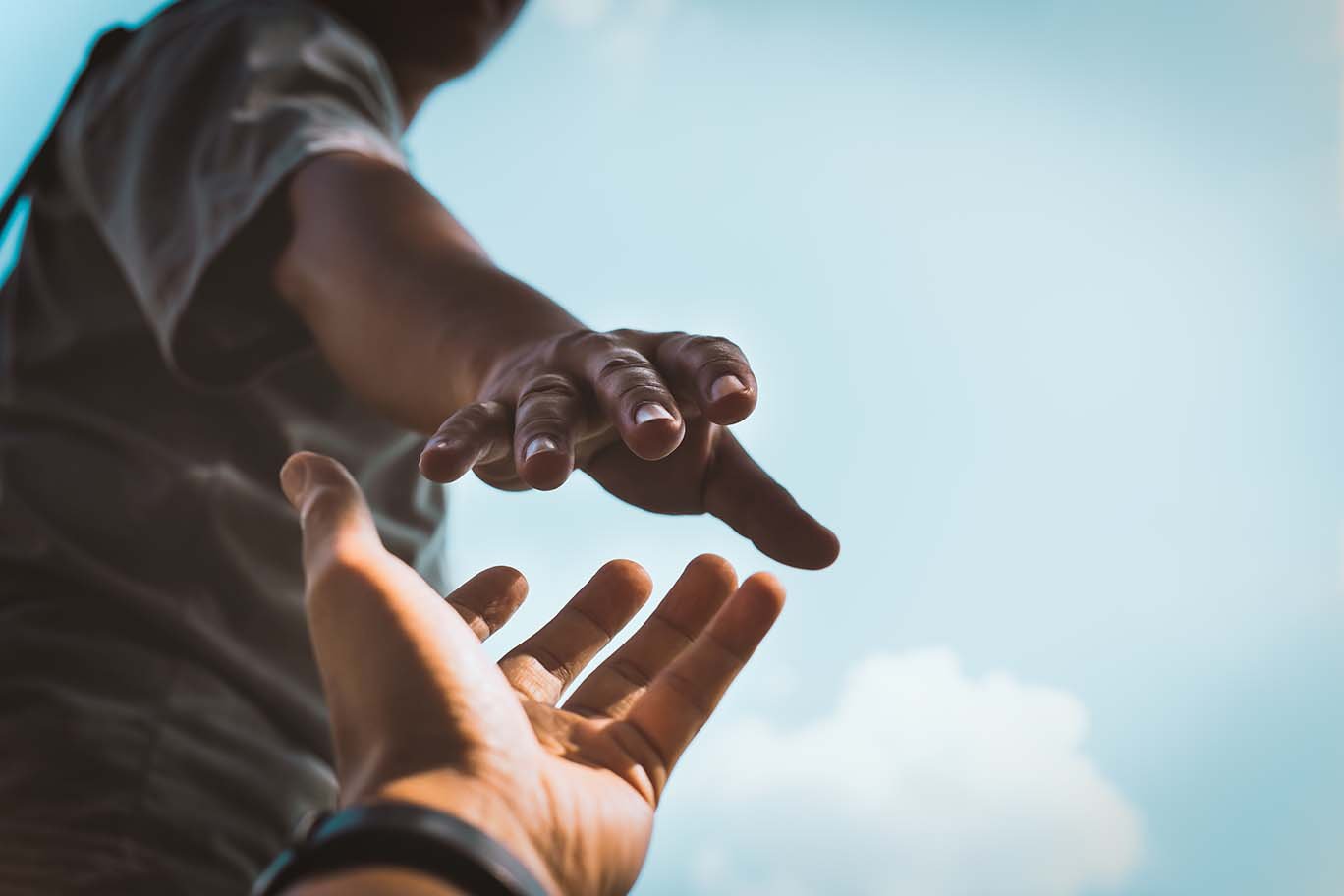 hands reaching out to help