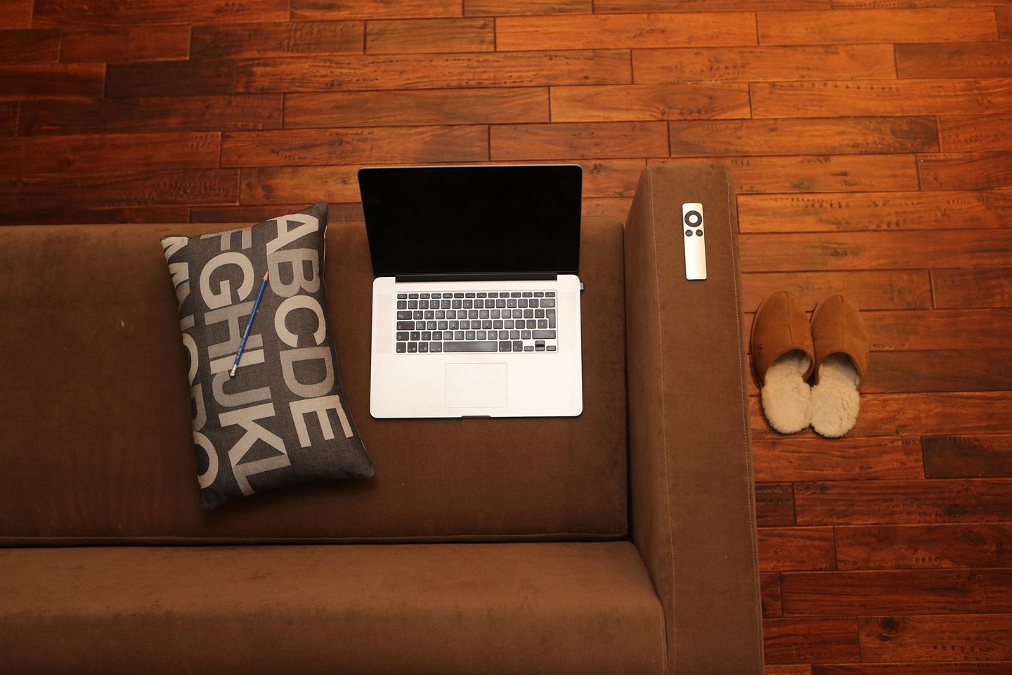 couch with laptop for telehealth appointments