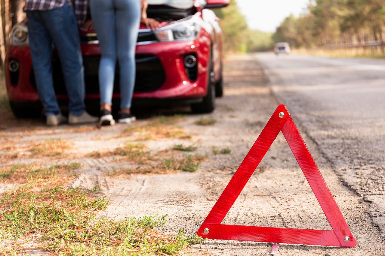 image of broken down car on side of road