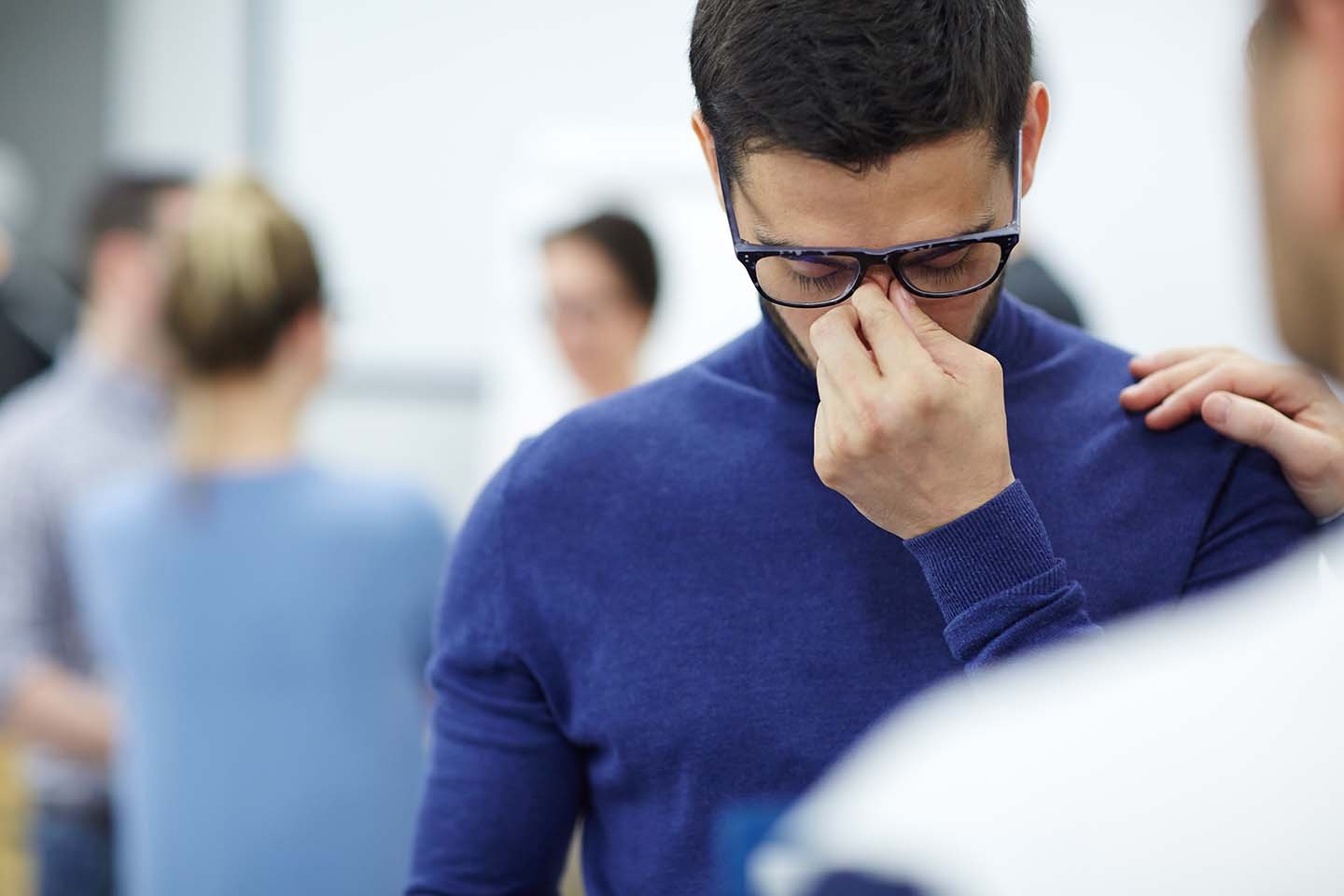 stressed man reflecting, representing symptoms of complex PTSD